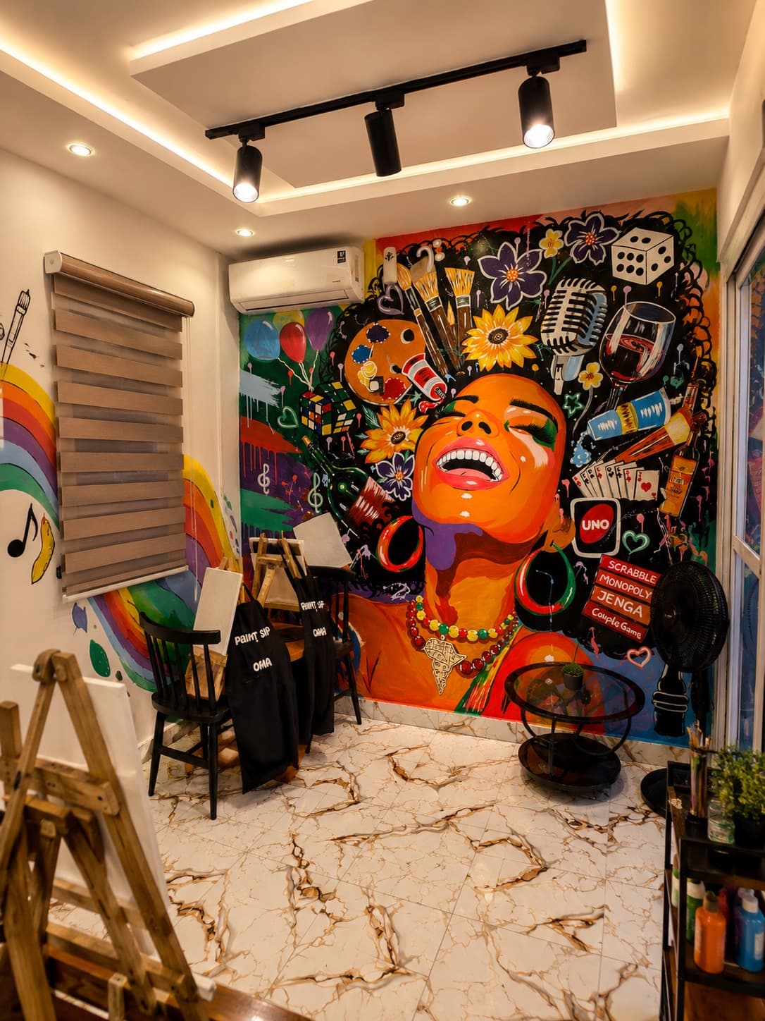 The colorful mural and creative setup inside the studio